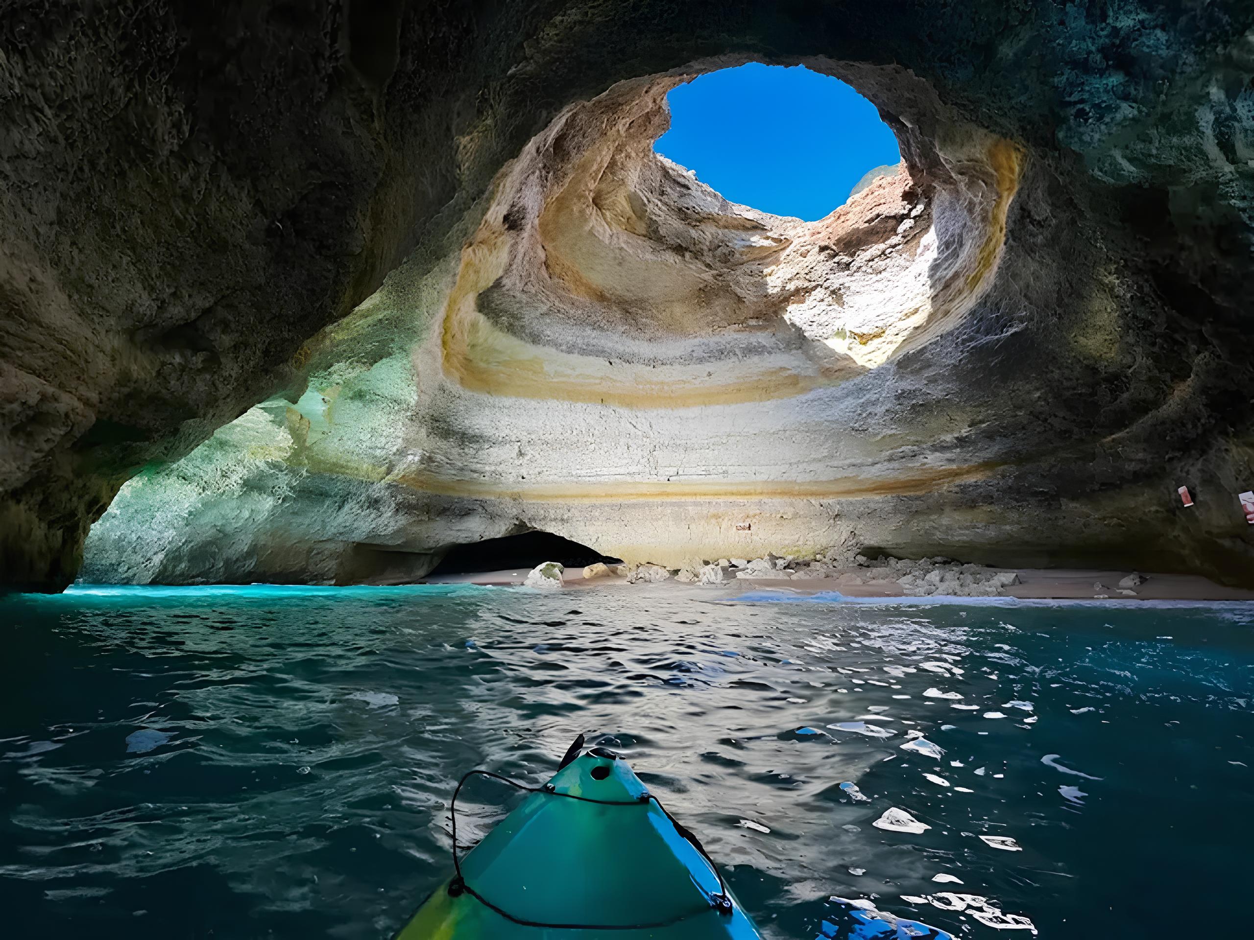 View from a kayak inside Benagil Cave during a calm morning tour